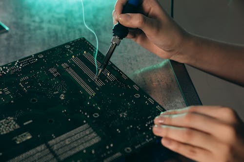 man hands working on computer motherbaord